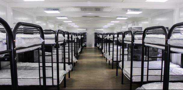 SMARTBRIX temporary shelter interior with rows of bunk beds